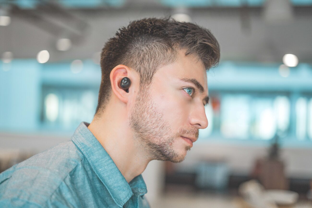 Wearing-Earbuds-scaled